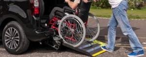 wheelchair entering a taxi